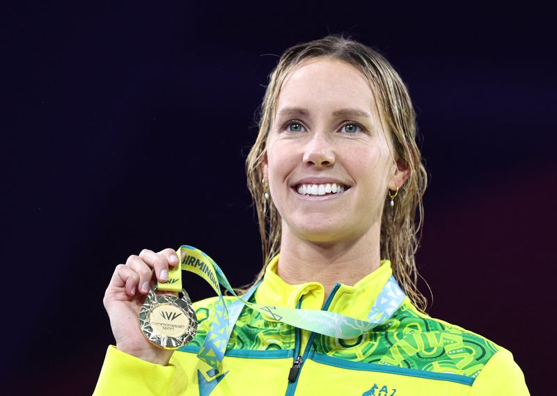 &copy; Reuters. Commonwealth Games - Women's 50m Freestyle - Medal Ceremony - Sandwell Aquatics Centre, Birmingham, Britain - July 31, 2022  Gold Medallist Australia's Emma McKeon celebrates on the podium during the medal ceremony REUTERS/Stoyan Nenov