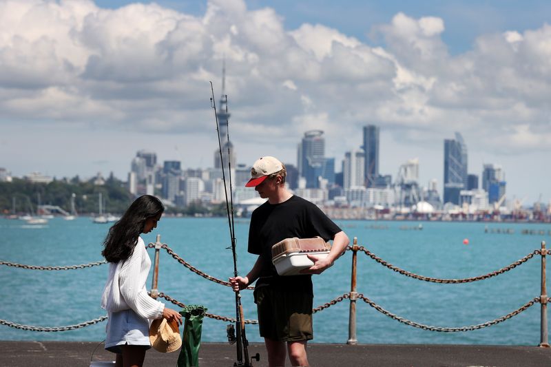 &copy; Reuters. FILE PHOTO - People prepare to go fishing from the Orakei Wharf as coronavirus disease (COVID-19) lockdown restrictions are eased in Auckland, New Zealand, November 10, 2021.  REUTERS/Fiona Goodall