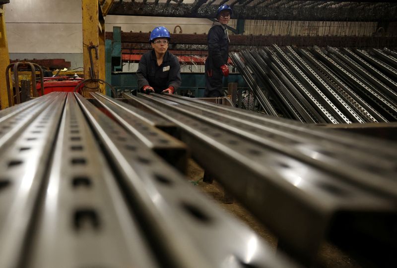 &copy; Reuters. A worker prepares pieces of metal to be galvanised inside the factory of Corbetts The Galvanizers in Telford, Britain, June 28, 2022. REUTERS/Phil Noble