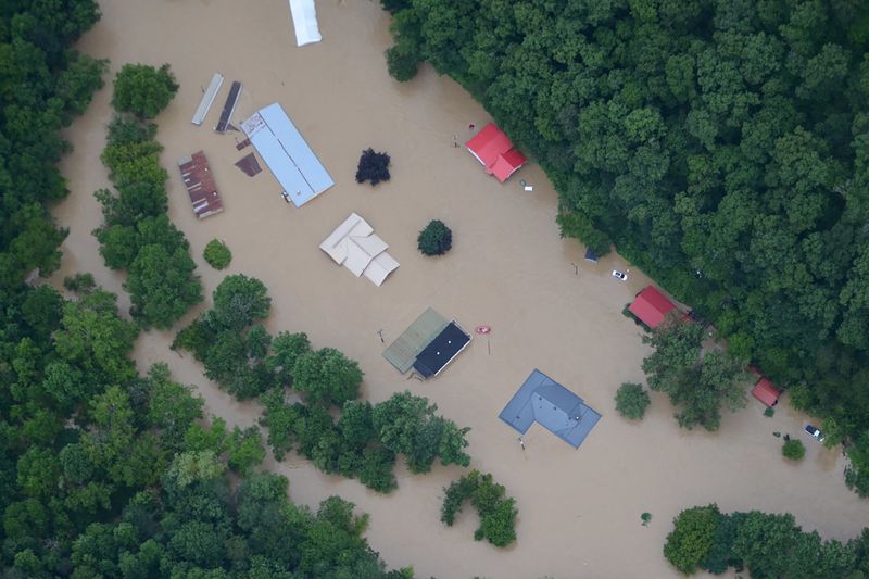&copy; Reuters. FILE PHOTO: A flooded area is flown over by a Kentucky National Guard helicopter deployed in response to a declared state of emergency in eastern Kentucky, U.S. July 27, 2022. U.S. Army National Guard/Handout via REUTERS