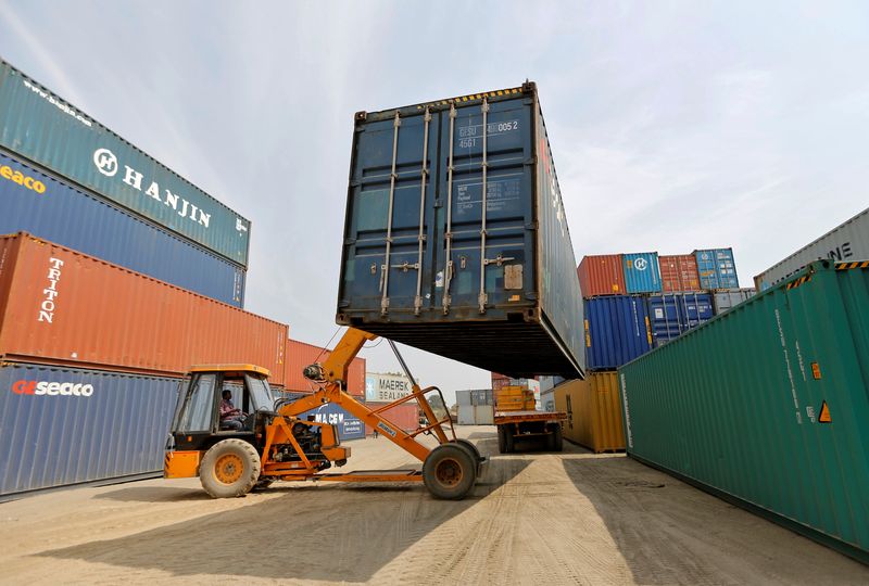 &copy; Reuters. FILE PHOTO: A mobile crane carries a container at Thar Dry Port in Sanand in the western state of Gujarat, India, February 13, 2017. Picture taken February 13, 2017. REUTERS/Amit Dave/File Photo