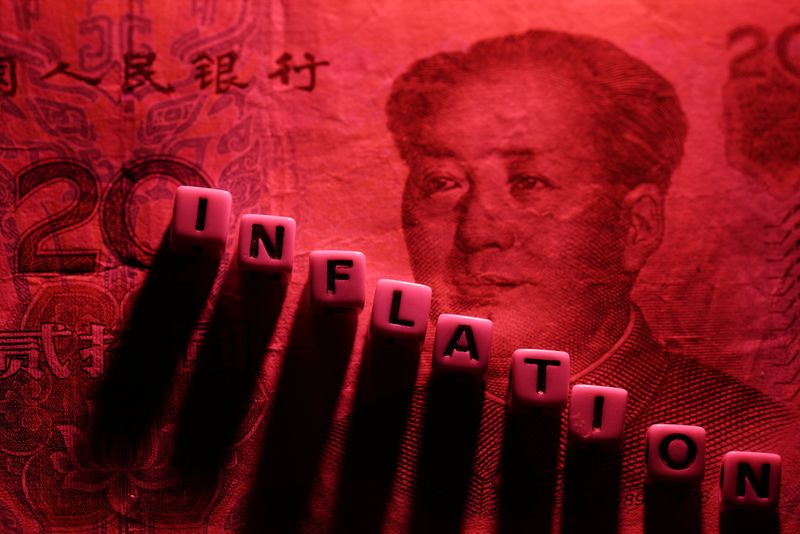 &copy; Reuters. Plastic letters arranged to read "Inflation" are placed on Chinese Yuan banknote in this illustration taken, June 12, 2022. REUTERS/Dado Ruvic/Illustration