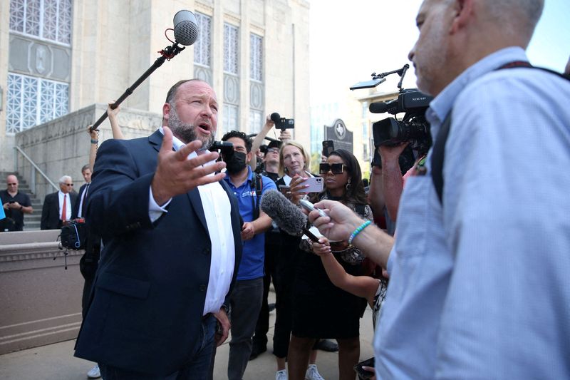 &copy; Reuters. FILE PHOTO: Alex Jones speaks with media after day six of trial at the Travis County Courthouse, in Austin, U.S. August 2, 2022. Briana Sanchez/Pool via REUTERS/File Photo