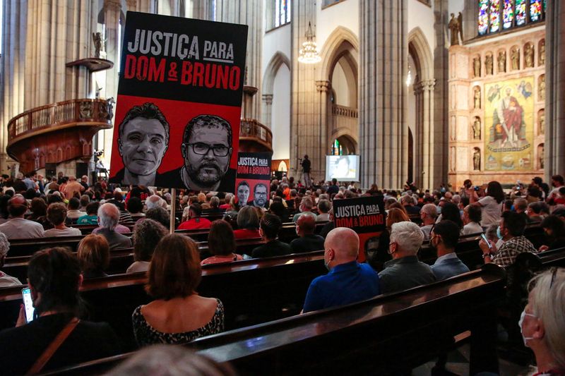 &copy; Reuters. FILE PHOTO - People attend a memorial service for indigenous expert Bruno Pereira and British journalist Dom Phillips, who were murdered in the Amazon, in Sao Paulo, Brazil  July 16, 2022. REUTERS/Suamy Beydoun 