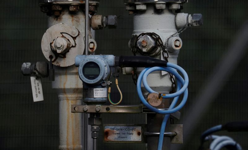&copy; Reuters. FILE PHOTO: Dials and valves are seen near a section of gas pipeline at a National Grid facility near Knutsford, Britain, October 11, 2021. REUTERS/Phil Noble