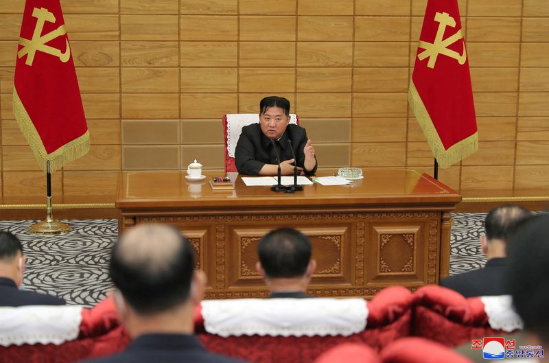 &copy; Reuters. FILE PHOTO: North Korean leader Kim Jong Un speaks at a politburo meeting of the Worker's Party on the country's coronavirus disease (COVID-19) outbreak response in this undated photo released by North Korea's Korean Central News Agency (KCNA) on May 21, 