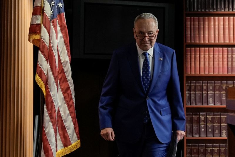 © Reuters. U.S. Senate Majority Leader Chuck Schumer (D-NY) walks into the Radio TV gallery to speak to the media after the 51-50 vote passed the 