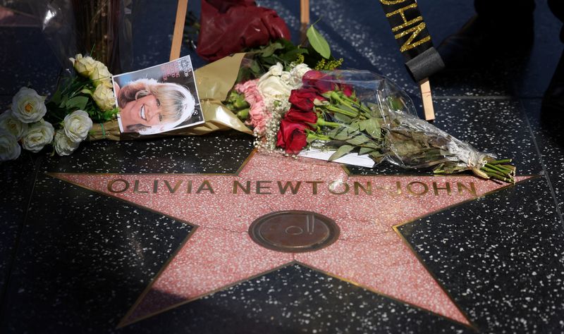 &copy; Reuters. The star of late actor Olivia Newton-John is pictured adorned with flowers and photographs on the Hollywood Walk of Fame in Los Angeles, California, U.S., August 8, 2022. REUTERS/Mario Anzuoni