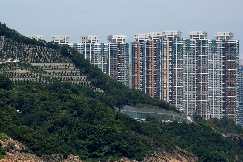 &copy; Reuters. FILE PHOTO: Private residential blocks are seen behind a cemetery at Tseung Kwan O district in Hong Kong, China September 15, 2018. REUTERS/Bobby Yip