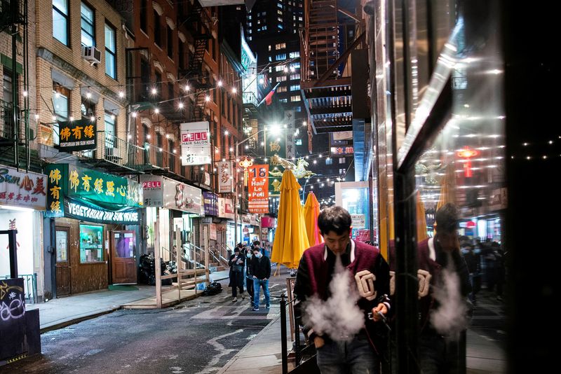 &copy; Reuters. FILE PHOTO: People make their way in a local street of Chinatown in the Manhattan borough of New York City, New York, U.S., March 25, 2021. REUTERS/Eduardo Munoz