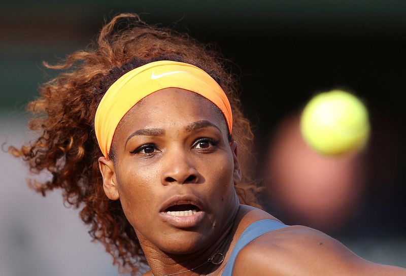 &copy; Reuters. FILE PHOTO: Serena Williams of the U.S. eyes the ball during her women's singles semi-final match against Sara Errani of Italy at the French Open tennis tournament at the Roland Garros stadium in Paris June 6, 2013. Williams defeated Errani 6-0 6-1.  REUT