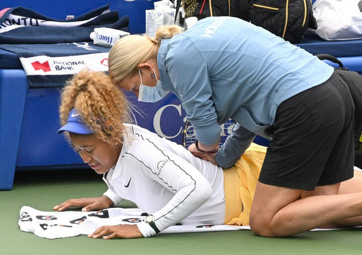 &copy; Reuters. テニスのナショナルバンク・オープンは９日、トロントで試合を行い、大坂なおみは女子シングルス１回戦のカイア・カネピ戦で腰痛により途中棄権となった（２０２２年　ロイター/USA TODA