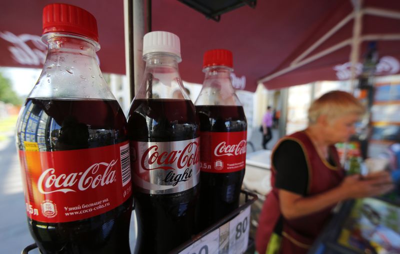 &copy; Reuters. FILE PHOTO: Coca-Cola bottles are seen on sale in central St. Petersburg, August 6, 2014. Coca-Cola Co confirmed on Wednesday it had taken advertisements off four Russian television channels, saying a fall in second-quarter sales had prompted a rethink of