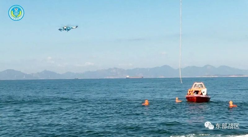 &copy; Reuters. A helicopter and boat under the Eastern Theatre Command of China's People's Liberation Army (PLA) take part in a maritime rescue drill, as part of military exercises in the waters around Taiwan, at an undisclosed location August 9, 2022 in this handout im
