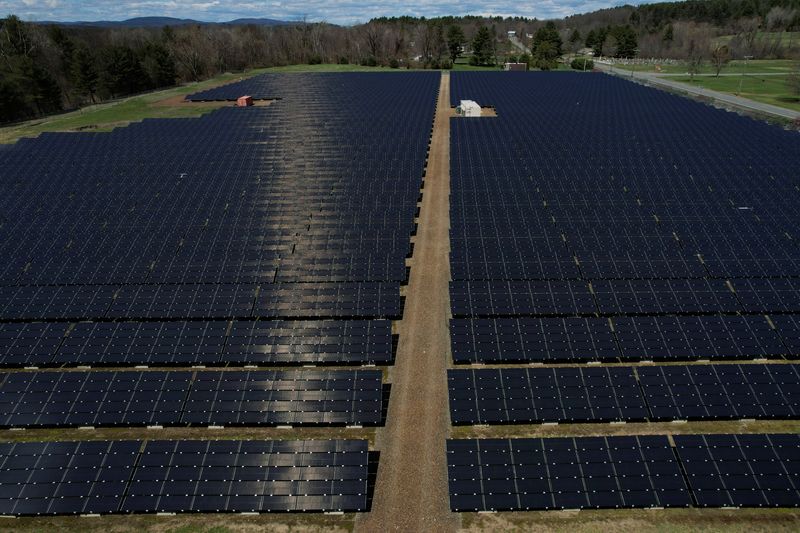 &copy; Reuters. FILE PHOTO: Solar panels are arrayed on Earth Day in Northfield, Massachusetts, U.S., April 22, 2022. Picture taken with a drone.     REUTERS/Brian Snyder