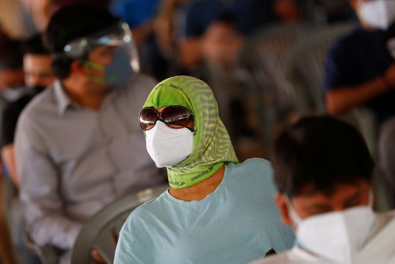 &copy; Reuters.     インド政府は、過去２週間に新型コロナウイルス感染が増加しているとして、首都ニューデリーにマスク着用義務を再導入した。写真は２０２１年５月、ニューデリーで撮影（２０２２
