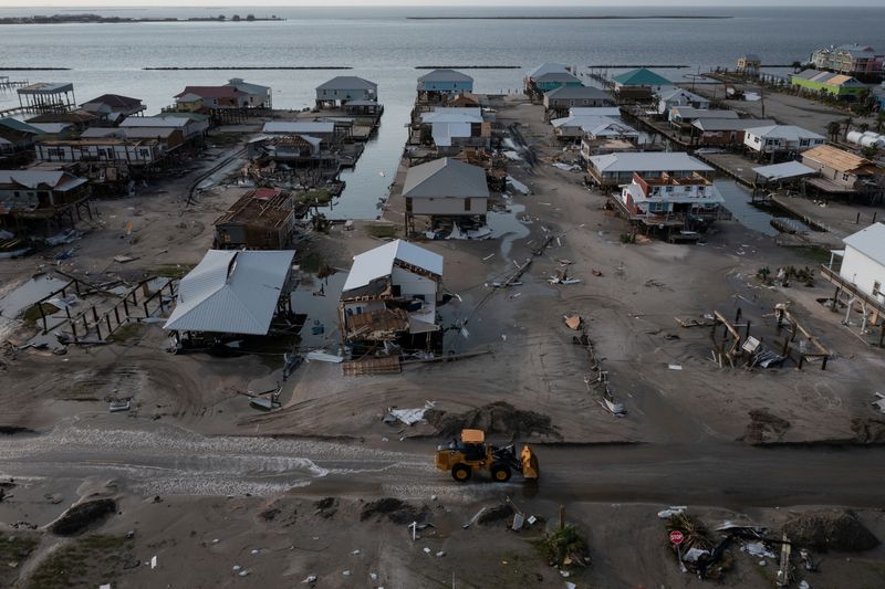 &copy; Reuters. FILE PHOTO: Houses and businesses are seen damaged in the aftermath of Hurricane Ida as the Category 4 hurricane devastated the town and barrier island of Grand Isle, Louisiana, U.S., September 2, 2021. Picture taken with a drone.  REUTERS/Adrees Latif