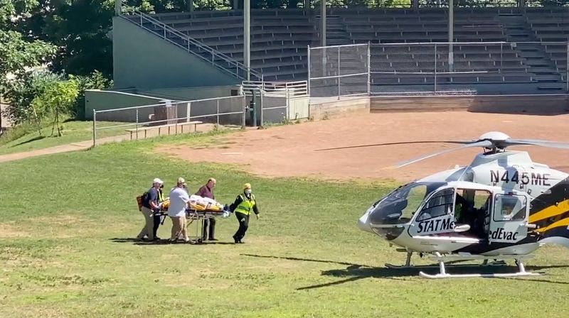 © Reuters. Author Salman Rushdie is transported to a helicopter after he was stabbed on stage before his scheduled speech at the Chautauqua Institution, Chautauqua, New York, U.S., August 12, 2022, in this screengrab taken from a social media video. TWITTER @HoratioGates3 /via REUTERS  THIS IMAGE HAS BEEN SUPPLIED BY A THIRD PARTY. MANDATORY CREDIT.