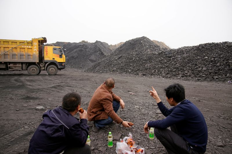 &copy; Reuters. FILE PHOTO" Coal truck drivers take break at lunch time in Pingdingshan, Henan province, China November 5, 2021. Picture taken November 5, 2021. REUTERS/Aly Song