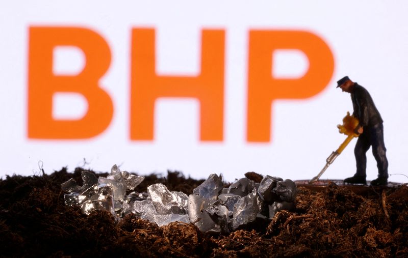 &copy; Reuters. FILE PHOTO: A small toy figure and mineral imitation are seen in front of the BHP logo in this illustration taken November 19, 2021. REUTERS/Dado Ruvic/Illustration