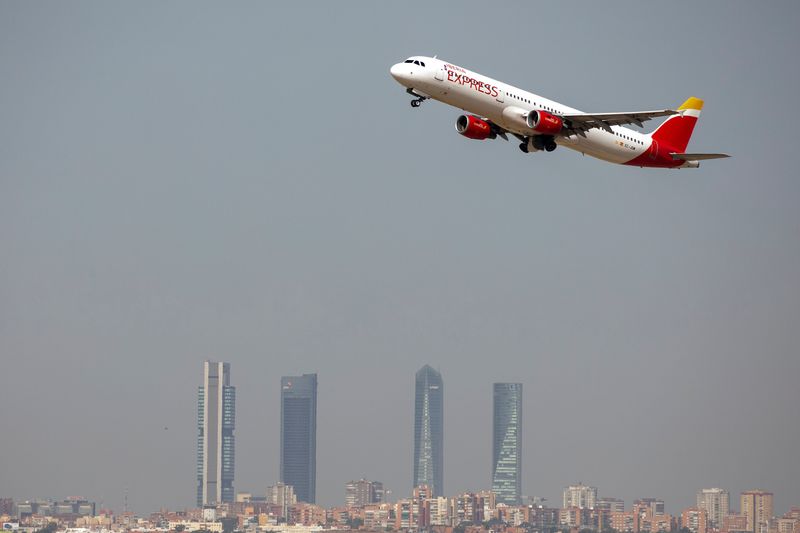 &copy; Reuters. FILE PHOTO: An Iberia Express Airbus A321-200 airplane takes off from the Adolfo Suarez Madrid-Barajas airport as seen from Paracuellos del Jarama, outside Madrid, Spain, August 8, 2018.  REUTERS/Paul Hanna
