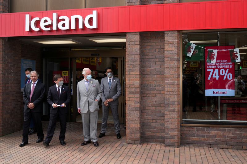 &copy; Reuters. FILE PHOTO: Britain's Prince Charles is given a shopfloor tour by Richard Walker Managing Director and Sir Malcolm Walker, Founder & Executive Chairman of Iceland Foods Ltd, in Deeside, Wales, Britain July 5, 2021. Christopher Furlong/Pool via REUTERS