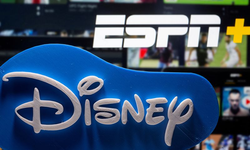 &copy; Reuters. FILE PHOTO: A 3D-printed Disney logo is seen in front of the ESPN+ logo in this illustration taken on July 13, 2021. REUTERS/Dado Ruvic/Illustration/File Photo