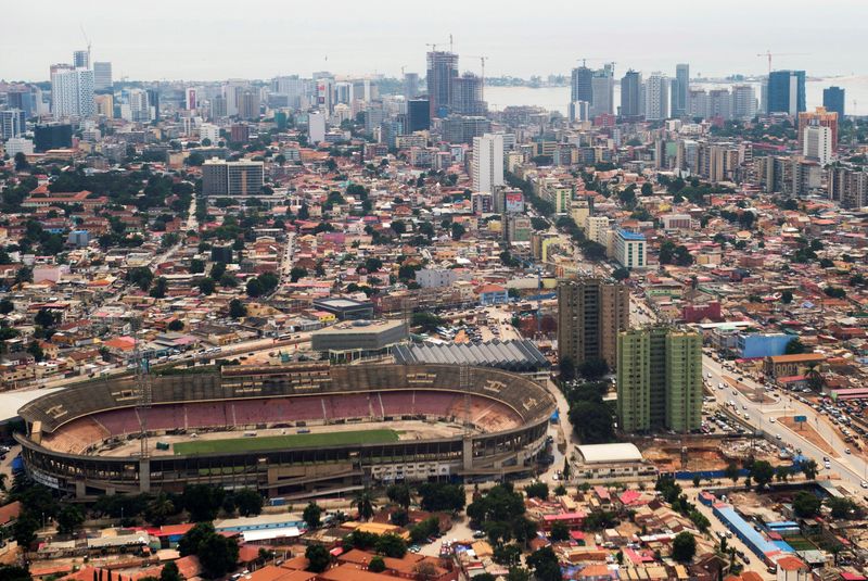 &copy; Reuters. FILE PHOTO: The Estadio da Cidadela stadium is seen with the skyline of central Luanda May 4, 2014. REUTERS/Saul Loeb/File Photo