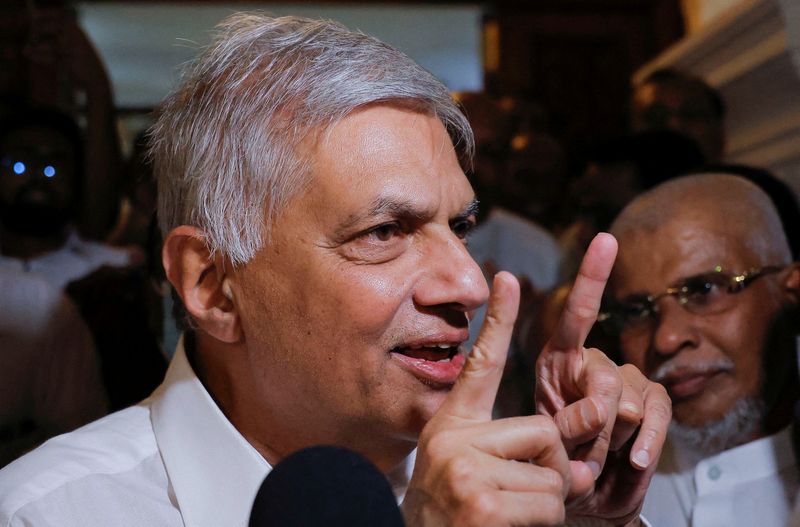 &copy; Reuters. FILE PHOTO: Ranil Wickremesinghe who has been elected as the Eighth Executive President under the Constitution speaks to media as he leaves a Buddhist temple, amid the country's economic crisis, in Colombo, Sri Lanka July 20, 2022. REUTERS/ Dinuka Liyanaw