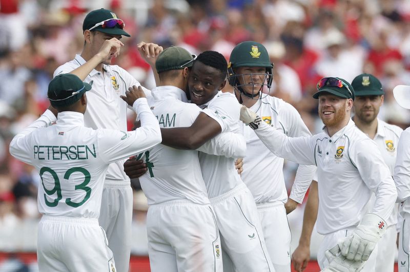 &copy; Reuters. Cricket - First Test - England v South Africa - Lord's Cricket Ground, London, Britain - August 18, 2022 South Africa's Kagiso Rabada celebrates with teammates after taking the lbw wicket of England's James Anderson Action Images via Reuters/Peter Cziborr