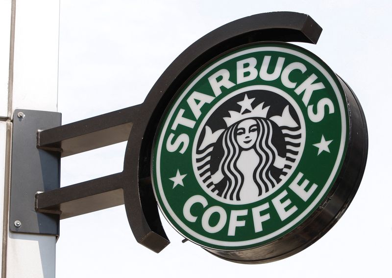 &copy; Reuters. FILE PHOTO: The Starbucks sign is seen outside one of its stores in New York July 3, 2008. REUTERS/Chip East (UNITED STATES)