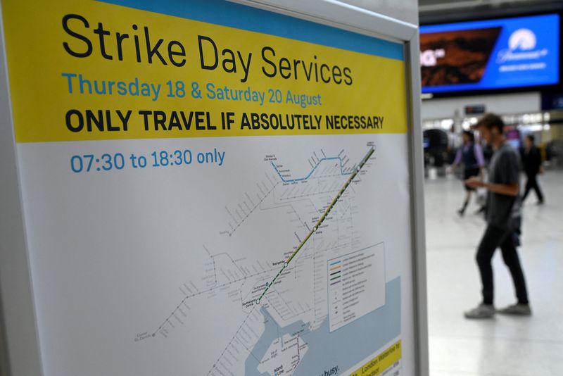 &copy; Reuters. A train timetable information message is displayed, as rail workers in Britain strike over pay and terms, at Waterloo Station in London, Britain, August 18, 2022. REUTERS/Toby Melville