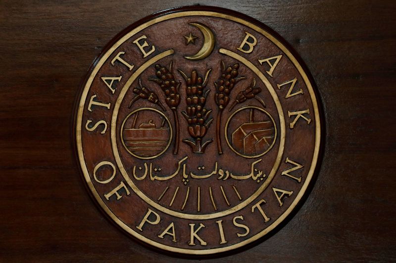 &copy; Reuters. FILE PHOTO: The logo of the State Bank of Pakistan (SBP) is pictured on a reception desk at the head office in Karachi, Pakistan July 16, 2019. REUTERS/Akhtar Soomro/File Photo
