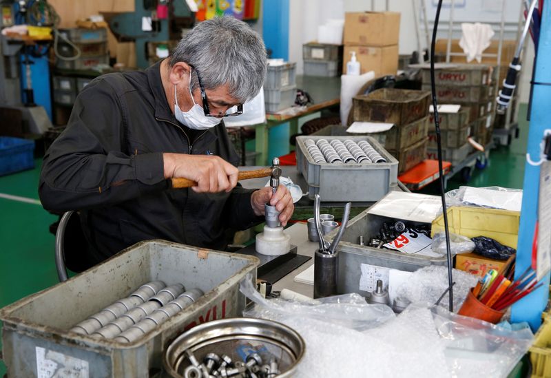 &copy; Reuters. A worker assembles an air drill at the factory of manufacturer Katsui Kogyo in Higashiosaka, Japan June 23, 2022.  REUTERS/Sakura Murakami