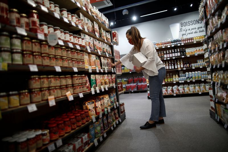 &copy; Reuters. FILE PHOTO: An employee restocks a sales display inside a Naturalia organic foods grocery store operated by Casino Group, following the outbreak of the coronavirus disease (COVID-19), in Bretigny-sur-Orge, near Paris, France, July 30, 2020. REUTERS/Benoit