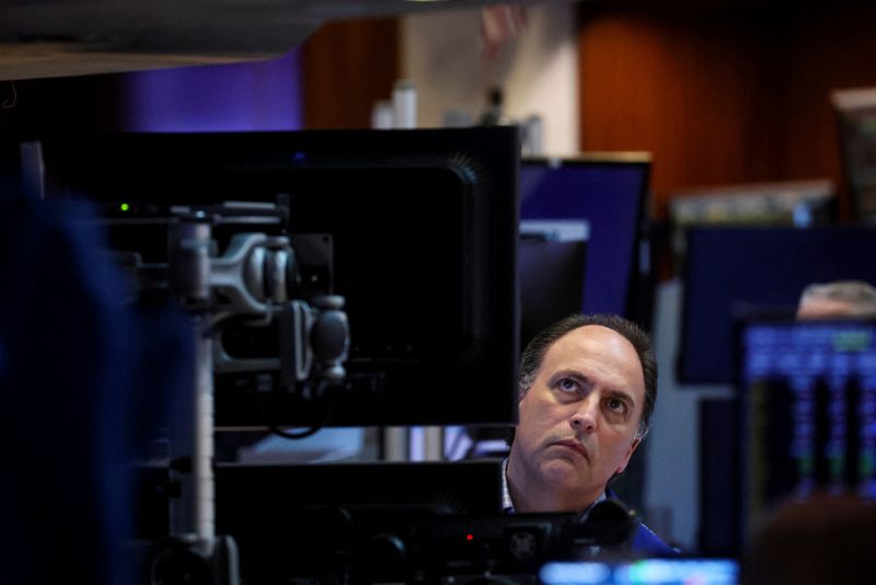 &copy; Reuters. FILE PHOTO: A traders watches Federal Reserve Chair Jerome Powell delivering remarks on the floor of the New York Stock Exchange (NYSE) in New York City, U.S., June 15, 2022.  REUTERS/Brendan McDermid