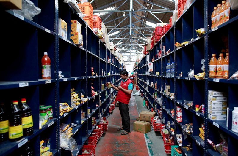 &copy; Reuters. FILE PHOTO: An employee scans a package for an order at a BigBasket warehouse on the outskirts of Mumbai November 4, 2014. REUTERS/Danish Siddiqui/File Photo