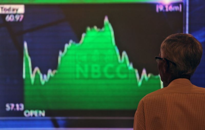 &copy; Reuters. FILE PHOTO: A man looks at a screen displaying news of markets update inside the Bombay Stock Exchange (BSE) building in Mumbai, India, May 23, 2019. REUTERS/Francis Mascarenhas