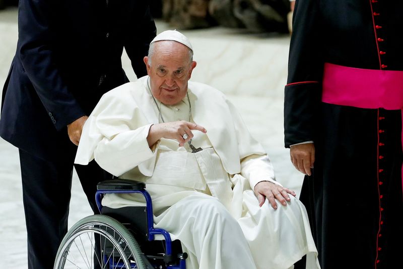 &copy; Reuters. Pope Francis leaves after the weekly general audience at the Vatican, August 17, 2022. REUTERS/Remo Casilli