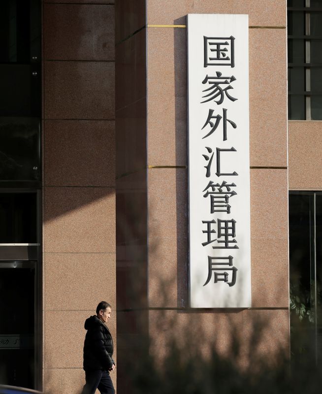 &copy; Reuters. FILE PHOTO: A man leaves the building of State Administration of Foreign Exchange (SAFE) in Beijing, China, January 11, 2017. REUTERS/Jason Lee