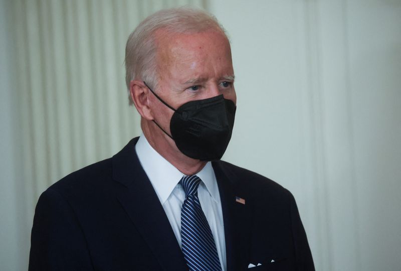 &copy; Reuters. FILE PHOTO: U.S. President Joe Biden listens to House Democratic Whip James Clyburn (D-SC) speak at the start of a bill signing ceremony for "The Inflation Reduction Act of 2022" where he will sign the act into law in the State Dining Room of the White Ho