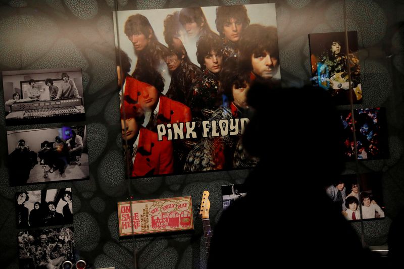 &copy; Reuters. FILE PHOTO: A woman is silhouetted at The Pink Floyd Exhibition: Their Mortal Remains at the V&A Museum in London, Britain May 9, 2017.  REUTERS/Stefan Wermuth