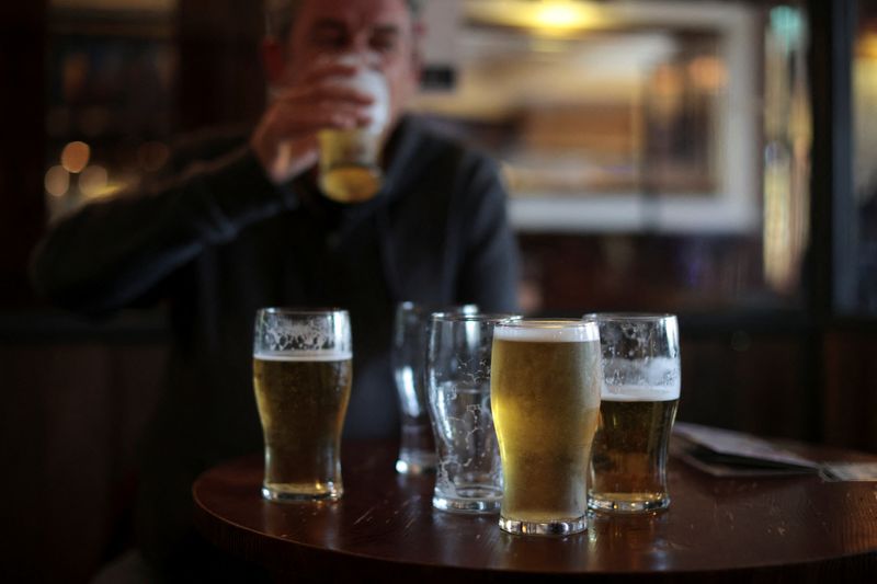 © Reuters. A man drinks beer at The Fox on the Hill pub as it reopens while coronavirus disease (COVID-19) restrictions continue to ease, in London, Britain, May 17, 2021. REUTERS/Hannah McKay