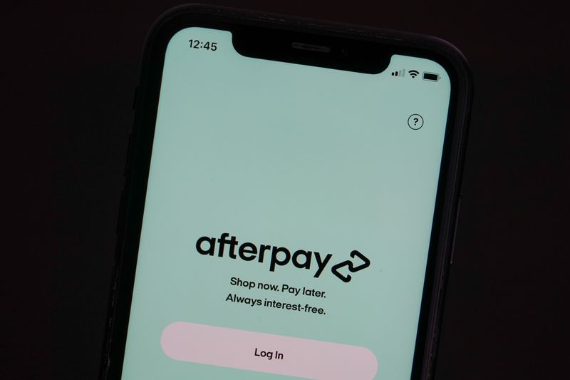 &copy; Reuters. FILE PHOTO: The Afterpay app is seen on the screen of a mobile phone in a picture illustration taken August 2, 2021.  REUTERS/Loren Elliott/Illustration