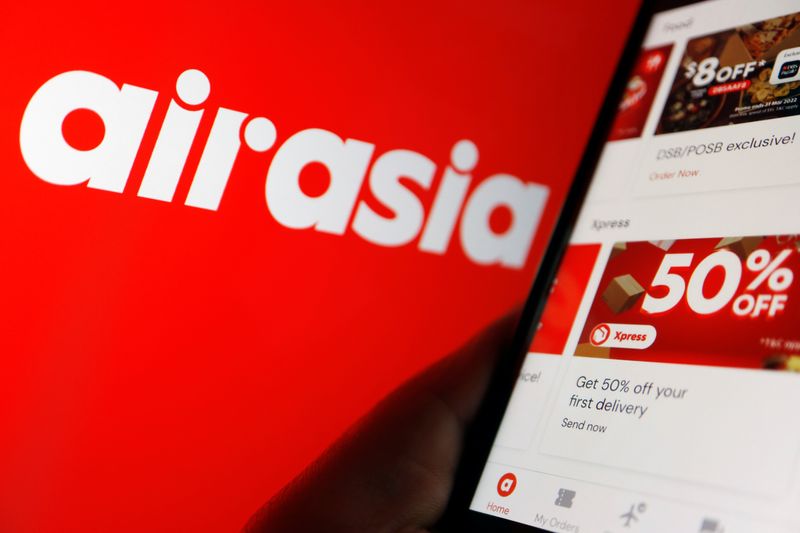 &copy; Reuters. The logo of AirAsia and airasia Super App under Capital A are seen displayed in this illustration picture taken March 7, 2022. REUTERS/Florence Lo/Illustration