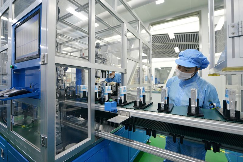 &copy; Reuters. FILE PHOTO: Workers are seen at the production line of lithium-ion batteries for electric vehicles (EV) at a factory in Huzhou, Zhejiang province, China August 28, 2018. REUTERS/Stringer  ATTENTION EDITORS - THIS IMAGE WAS PROVIDED BY A THIRD PARTY. CHINA