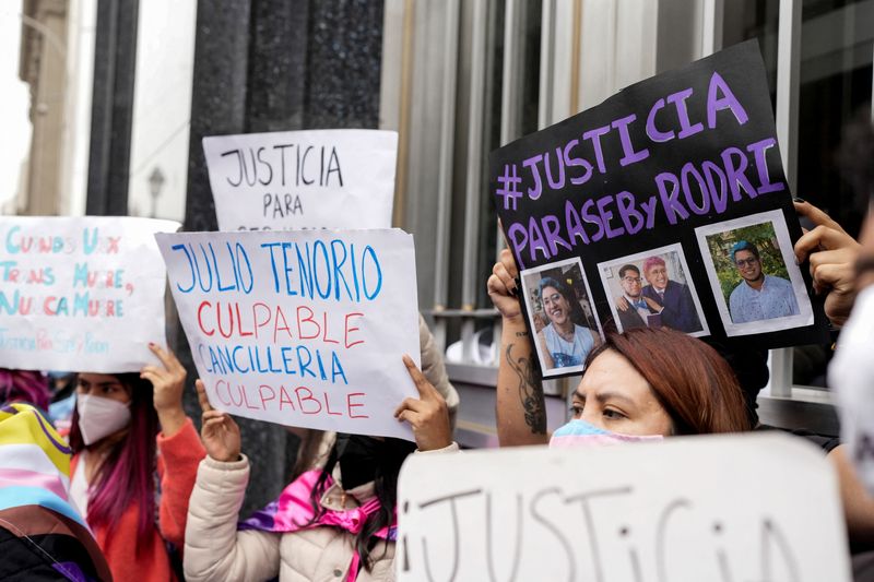 &copy; Reuters. Demonstrators hold up signs during a protest to demand justice for Rodrigo Ventosilla, a Peruvian graduate student at Harvard and activist for transgender rights who died on the island of Bali days after being detained for alleged cannabis possession alon