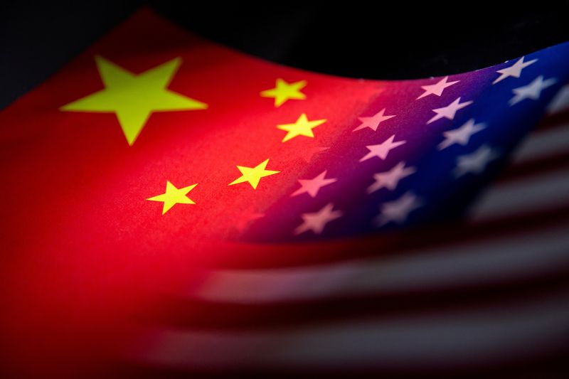 &copy; Reuters. FILE PHOTO: China and U.S. flags are seen printed on paper in this illustration taken January 27, 2022. REUTERS/Dado Ruvic/Illustration