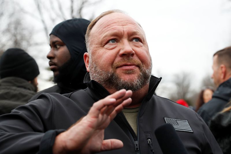 &copy; Reuters. FILE PHOTO: Right-wing radio talk show host Alex Jones speaks as supporters of U.S. President Donald Trump gather in front of the Supreme Court ahead of the U.S. Congress certification of the November 2020 election results during protests in Washington, U