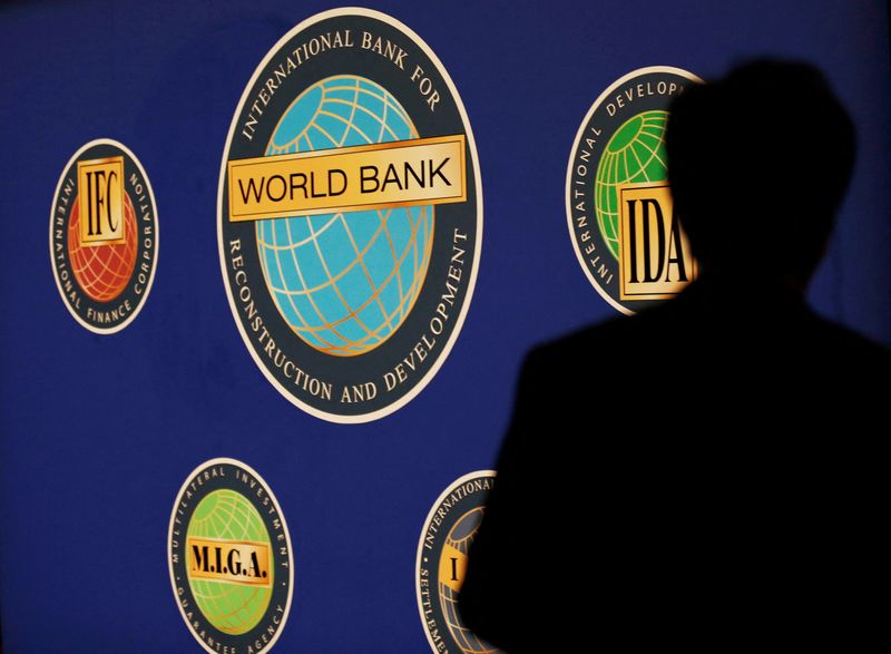 &copy; Reuters. FILE PHOTO: A man is silhouetted against the logo of the World Bank at the main venue for the International Monetary Fund (IMF) and World Bank annual meeting in Tokyo October 10, 2012. REUTERS/Kim Kyung-Hoon
